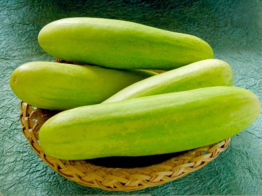 Four Cucumber green vegetable in basket , India