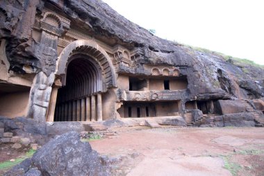 Bhajas rock cut caves dating around 2nd century BC in hills near Lonavala , Maharashtra , India clipart