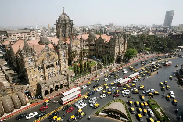 stock image Traffic outside of Victoria Terminus VT now Chhatrapati Shivaji Terminus CST in Bombay Mumbai , Maharashtra , India UNESCO World Heritage