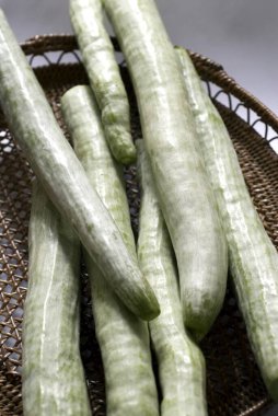 Snake gourd few green fresh long vegetable clipart