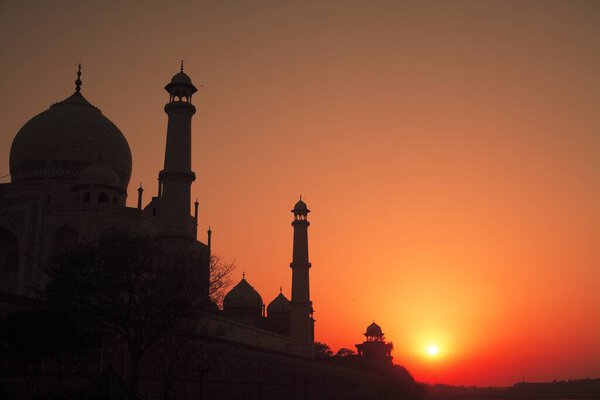 Sunset view of Taj Mahal Seventh Wonders of World on south bank of Yamuna river , Agra , Uttar Pradesh , India UNESCO World Heritage Site
