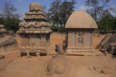 Pancha Rathas in foreground Nandi statue Draupadi Ratha on left Arjuna Ratha carved Monolith rock carving temples , Mahabalipuram , District Chengalpattu , Tamil Nadu , India UNESCO World Heritage Site clipart