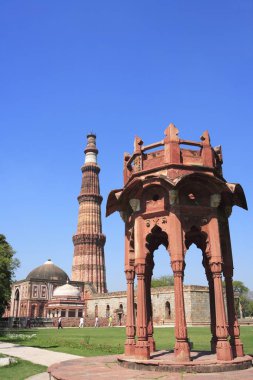 Smiths Folly and Qutab Minar built in 1311red sandstone tower , Delhi , India UNESCO World Heritage Site clipart