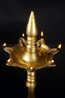 Brass lamp in India clipart