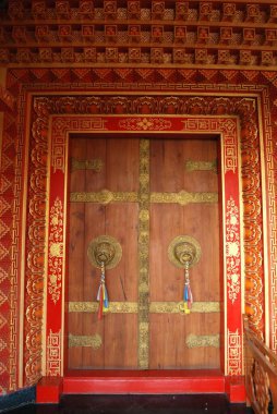 Decorated wooden gate of vajra vidya vihar temple, Sarnath, Varanasi, Uttar Pradesh, India  clipart