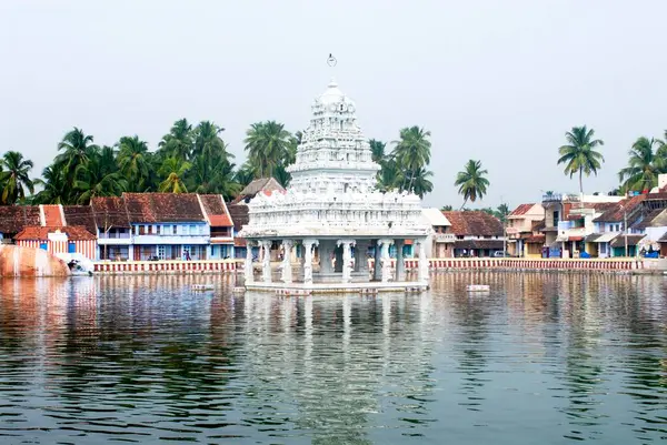 stock image Holy tank and typical Mangalore tiled roof village houses at Suchindram, 11 kilometres from Kanyakumari, Tamil Nadu, India 