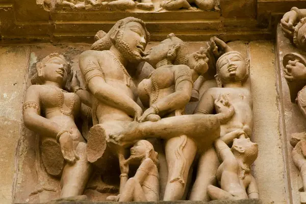 Erotic sculpture of loving couple penis in woman , Khandariya Mahadev temple at Khajuraho , Madhya Pradesh , India