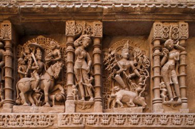 Statues carved on wall in Heritage architecture, Step well Rani ni Vava, Patan, Gujarat, India  clipart