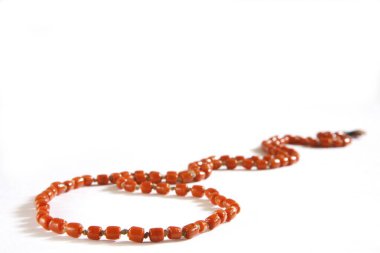 Concept , munga mala coral used in rosary on white background clipart