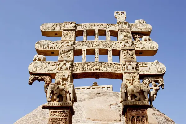 stock image East gateway or torna of maha stupa no 1 with depiction of stories engrave decorations erected at Sanchi , Bhopal , Madhya Pradesh , India