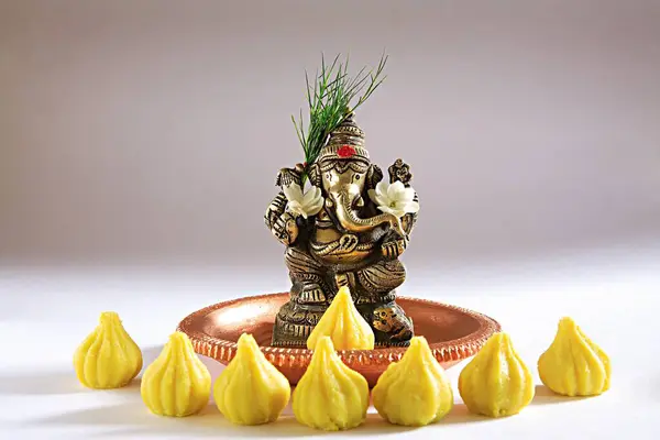 stock image Indian festival Ganesh chaturthi celebration idol of ganpati elephant headed god in plate on white background, Bombay Mumbai, Maharashtra, India 