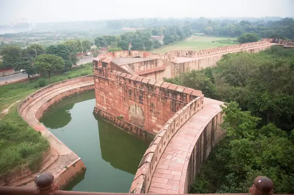 Sand stone wall and water canal for safety of Agra Fort , Agra , Uttar Pradesh , India