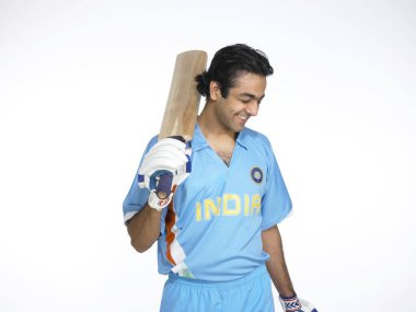 Indian batsman happy for good score in cricket match  clipart