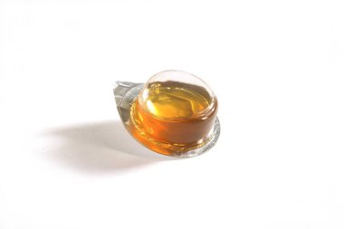 Close view of Madhu shahad honey in plastic container on white background clipart