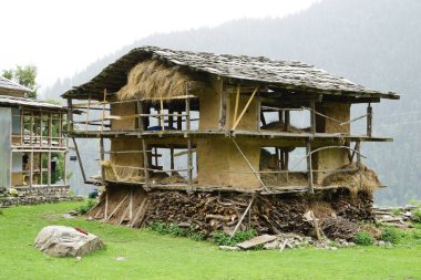 Wood Storage house, Sarchi Village, Tirthan Valley, Himachal Pradesh, India, Asia clipart