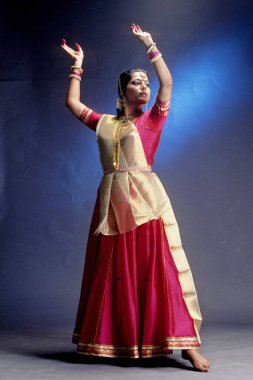 woman performing kathak indian classical dance, india  clipart