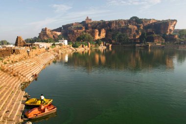 Agastya lake ; Yellamma temple 7th century and north fort temples in Badami ; Karnataka ; India clipart