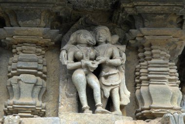 Youth approaches to donkey faced lady in Amaru Sataka at Channakesava Vishnu temple ; Belur ; district Hassan ; Karnataka ; India clipart