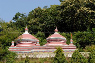 Shri Dasabhuj Lakshmi Ganesh temple on hill surrounded by greenery at Hedvi ; Konkan region ; Taluka Guhagar ; District Ratnagiri ; Maharashtra ; India clipart