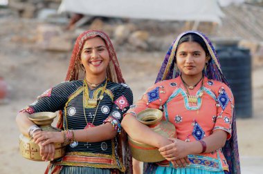 Rabari girls carrying vessels, Bhuj, Kutch, Gujarat, India   clipart