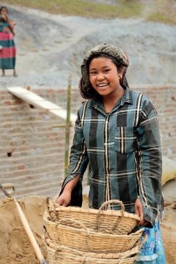 Tribal girl working on railway project site, ambassa, tripura, india, asia