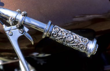 Motorcycle handle, closeup view at daytime  clipart