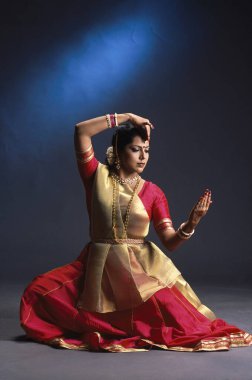 Kathak, woman performing classical dance of India  clipart
