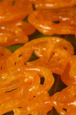 Indian sweet dish jalebi made by frying lentil dough clipart