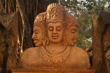 Replica of Maheshmurty ; three faces of Lord Shiva ; near Elephanta Caves ; Gharauri now known as Elephanta Island ; District Raigad ; Maharashtra ; India clipart
