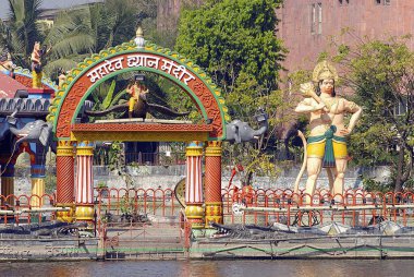 Idol of Lord Hanuman ; colourfully painted Mahadeo Dhyan mandir ; lord Shiva meditation temple built on island inside Masunda lake or Talao Pali ; Thane ; Maharashtra ; India clipart