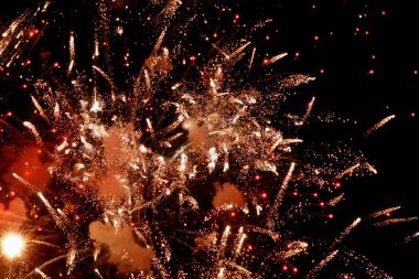 Diwali fireworks in the dark night sky clipart