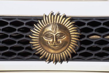 Emblem of sun on car dash, Mumbai, India, Asia clipart