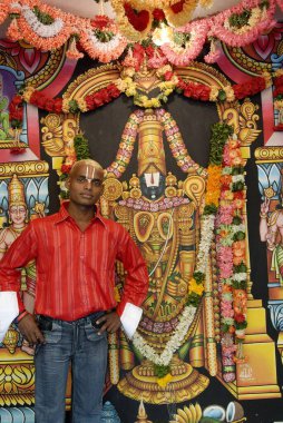 A photographic studio at Tirumalai Tirupati temple town , Andhra Pradesh , India clipart