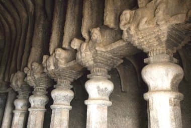 Richly carved pillars in Buddhist caves on mountain at Lenyadri, taluka Junnar, district Pune, Maharashtra, India  clipart