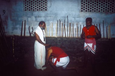 Kalaripayattu Traditional Martial Art of Kerala being practiced by Sri Muralidharan Gurukal and his disciples, Kottayam, Kerala, India  clipart
