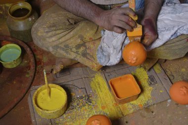 Artist Painting Wooden Fruits,Sawantwadi,Maharashtra,India  clipart