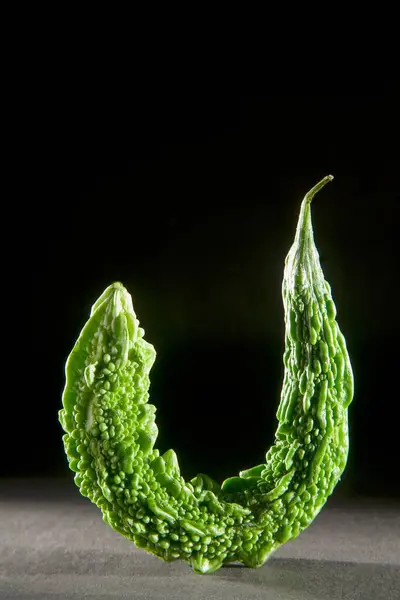 stock image bitter gourd momordica charantia on black background