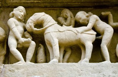 unnatural sex with horse sculpture at Khajuraho Madhya Pradesh India Asia clipart