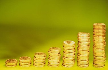 Growth from coins isolated on bright background clipart