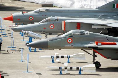 Indian air force fighter planes and rockets launchers displaced for public view at Santa Cruz airport area, Bombay Mumbai. Maharashtra. India  clipart