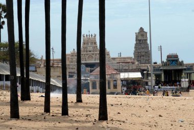 Subrahmanya Swami temple view from near by palm grove ; Tiruchendur ; Tamil Nadu ; India clipart