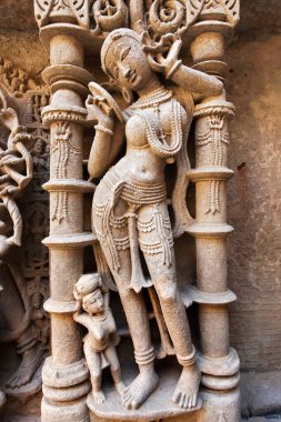 Nayika ; Rani ki vav ; step well ; stone carving ; Patan ; Gujarat ; India clipart