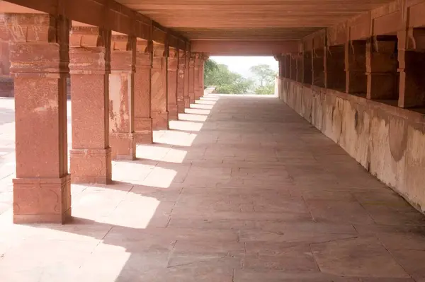 stock image Pillars Sunlight, red stone Mughal architecture, Fatehpur Sikiri, Uttar Pradesh, India 