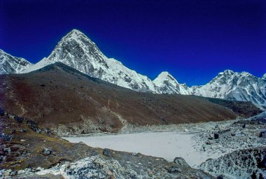 Pumeri and kala patthar peaks from gorakshep on everest base camp trek, nepal, Asia clipart