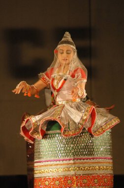 Ras Leela ; famous classical Manipuri dance form is based on the legendary love of Radha-Krishna and devotion of gopis to lord Krishna ; Imphal ; Manipur ; India clipart