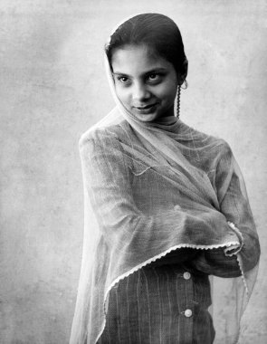 Indian girl in dress smiling portrait in studio Kulri Mussoorie  Uttar Pradesh India 1940s   clipart