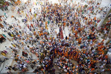 Sikh devotees taking part in procession at the Sachkhand Saheb Gurudwara for 300th year of Consecration of perpetual Guru Granth Sahib on 30th October 2008, Nanded, Maharashtra, India  clipart