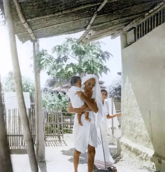 stock image Mahatma Gandhi carrying Anand son of Shardaben Shukla at Satyagraha Ashram, Sevagram, Wardha, Maharashtra, India, Asia, May 1940 