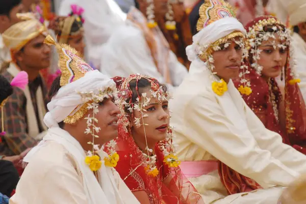 stock image Couples getting married at mass marriage function organized by Sant Nirankari Mission at Airoli, New Bombay now Navi Mumbai, Maharashtra, India  