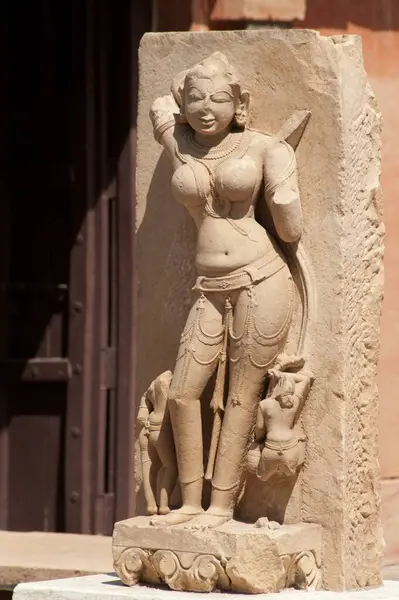 stock image Statue of nayika carved on stone at gujri mahal museum; Gwalior, Madhya Pradesh, India 